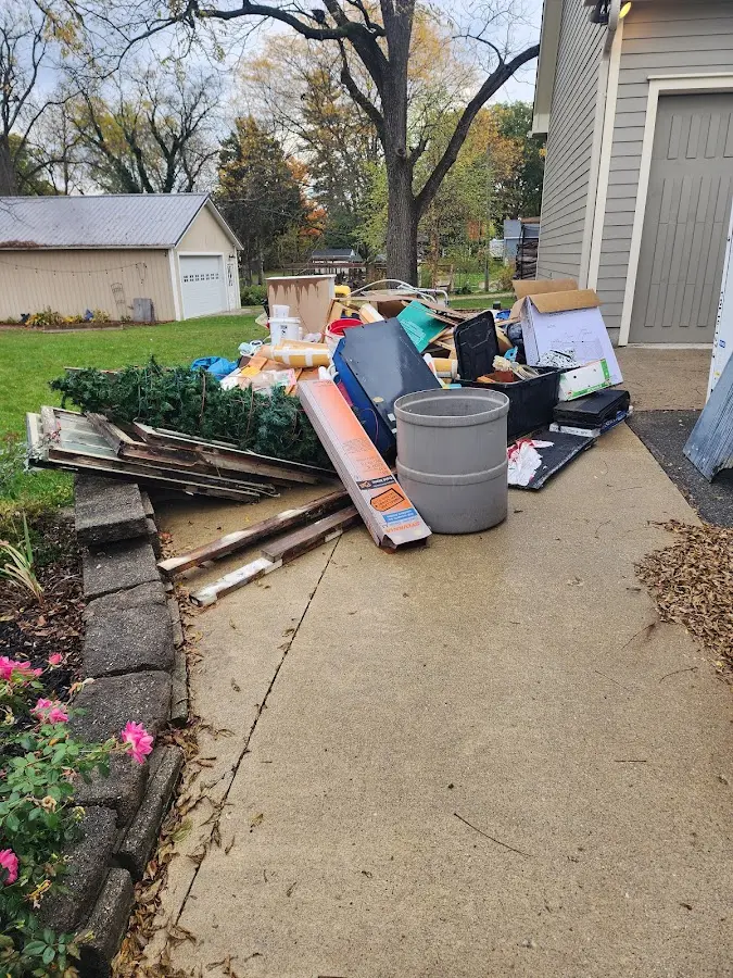 Dumpster being loaded with debris for 3 Yard Dumpster Rental in Northampton